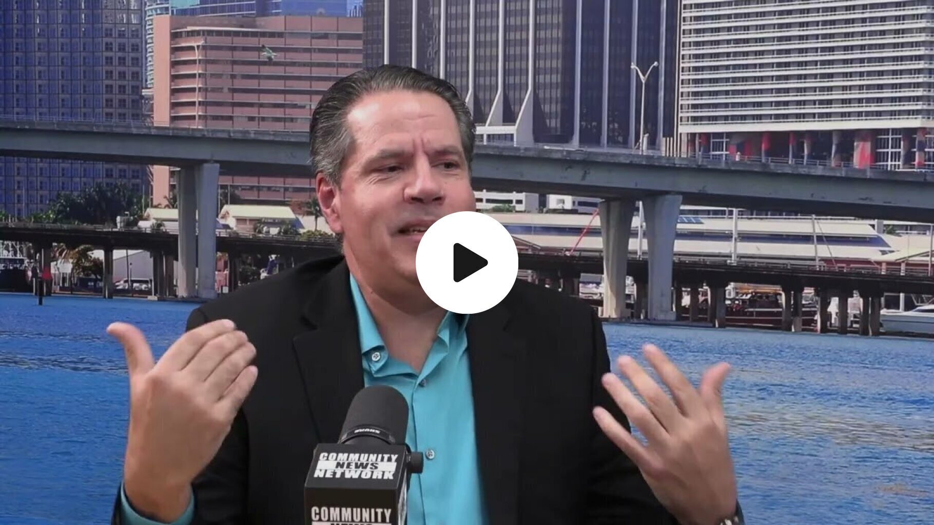 Frank Calderon from the Miami-Dade Solid Waste Department speaks with Robert Vargas