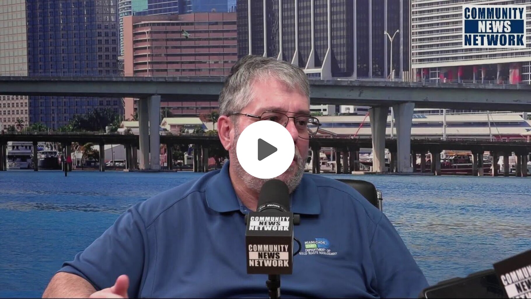 Michael Miller talks with Frank Calderon of Miami Dade Solid Waste Department